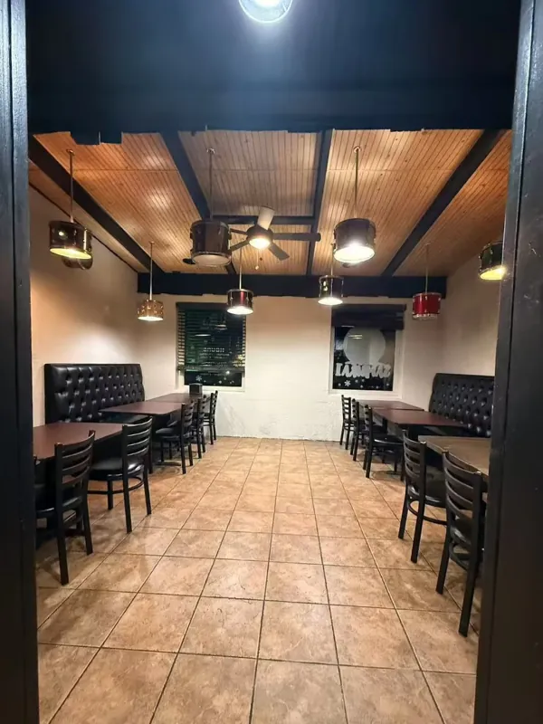 Booth seating area with pendant lights at Osaka Ripley, a Japanese Restaurant in Ripley